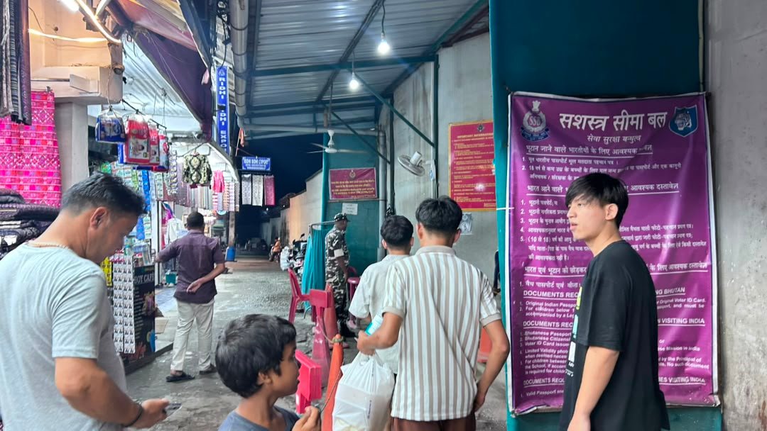 Jaigaon market street at night with shopfronts
