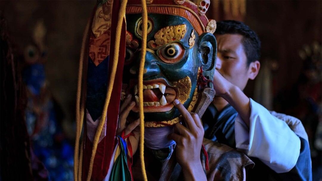 Preparing a mask backstage at Jakar Tshechu